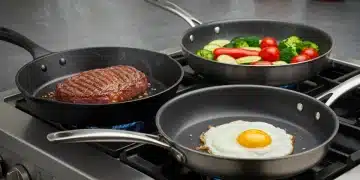 Comparison of cast iron, stainless steel, and non-stick pans on a stovetop, demonstrating different cooking styles.