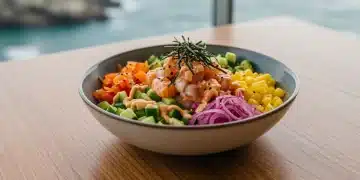Vibrant fusion poke bowl with fresh ingredients, showcasing Pacific Rim and West Coast culinary blend.