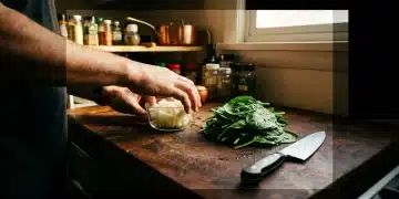 A person's hands preparing vegetables in an organized kitchen, showcasing the mise en place technique for efficient meal prep, high-contrast lighting.