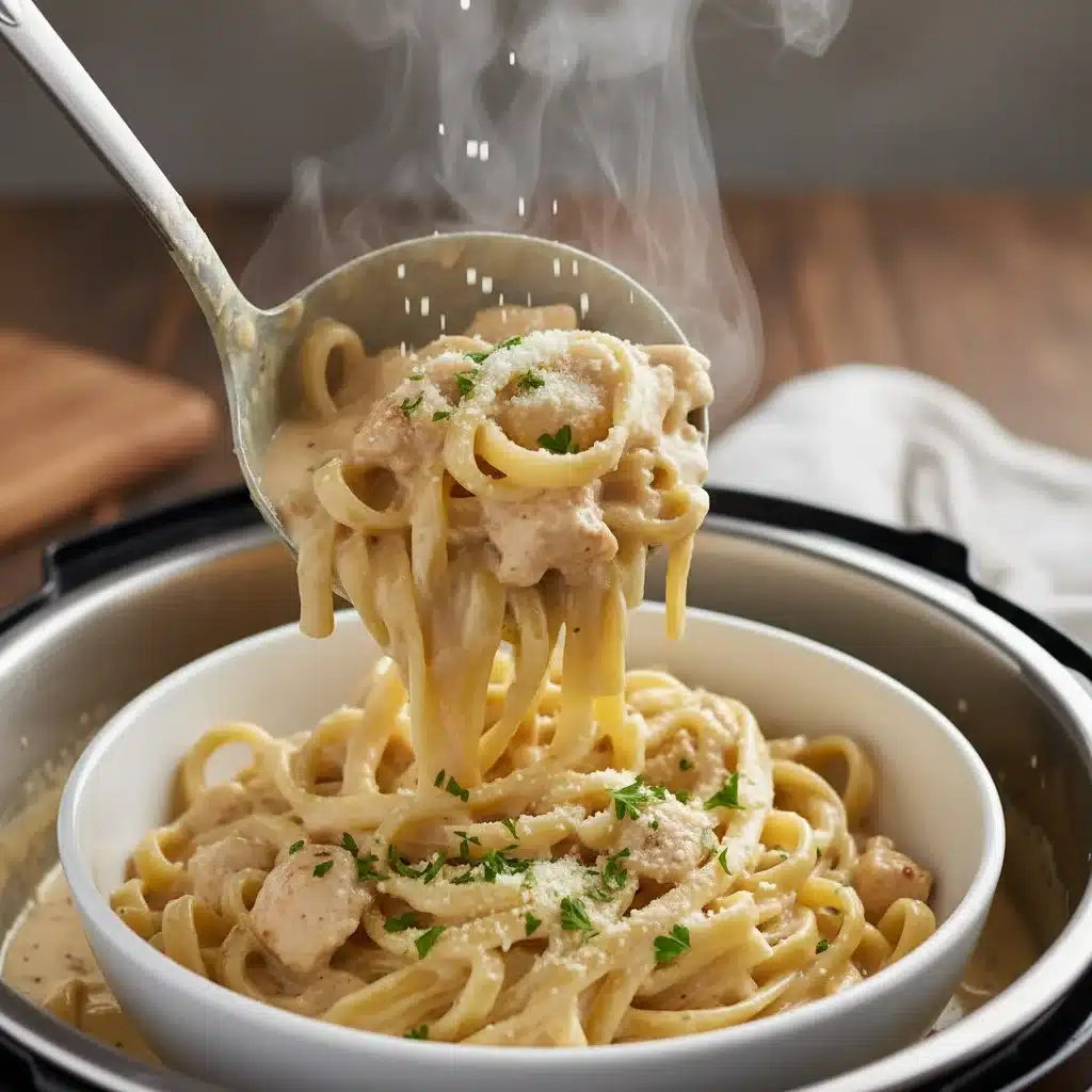 Creamy Instant Pot Chicken Alfredo served in a bowl, garnished with parsley and cheese.